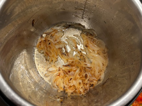 Onions after they have cooked down in the inner chamber of the Instant Pot.