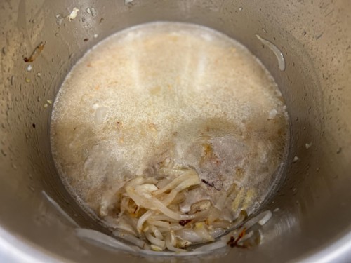 Liquids added to the onions, garlic, and ginger in the Instant Pot.