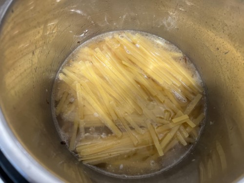 Noodles in the instant pot with the other ingredients.