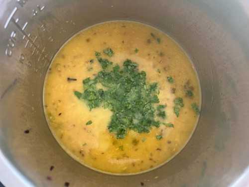 Adding cilantro and lime to Instant Pot dal.