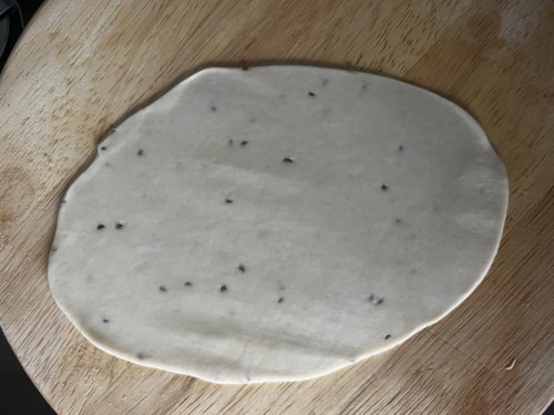 Rolling dough into an oval.