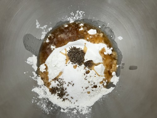 Combining flour with ghee and spices.