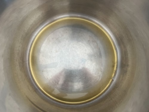 Adding ghee to the insert of a stainless Instant Pot insert.
