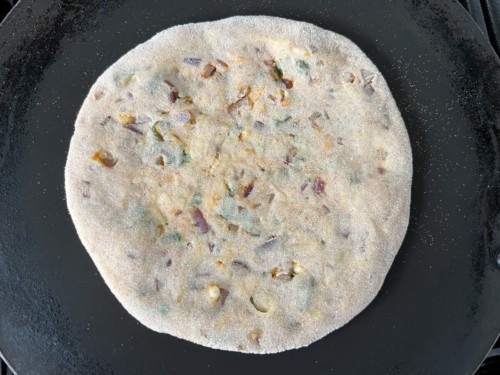 Bubbles forming on top of a paratha.