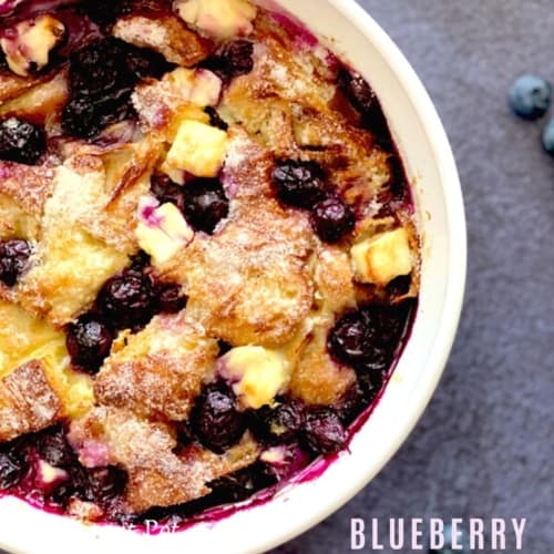 Blueberry bread pudding served in a white bowl