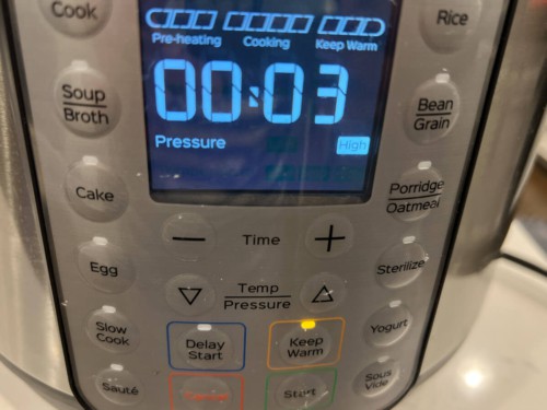 Close view of Instant Pot with 3 minutes on the timer.
