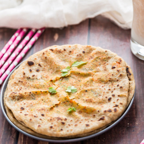Broccoli carrot paratha served on a black plate