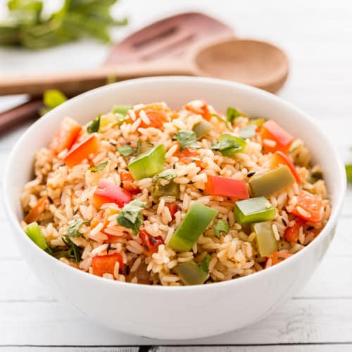 Spicy bell pepper rice served in a white bowl