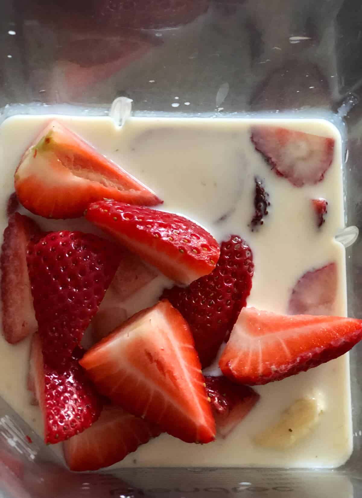 Strawberry, Banana and milk in a blender